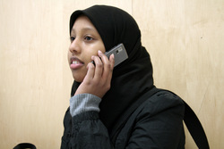 Young woman using telephone